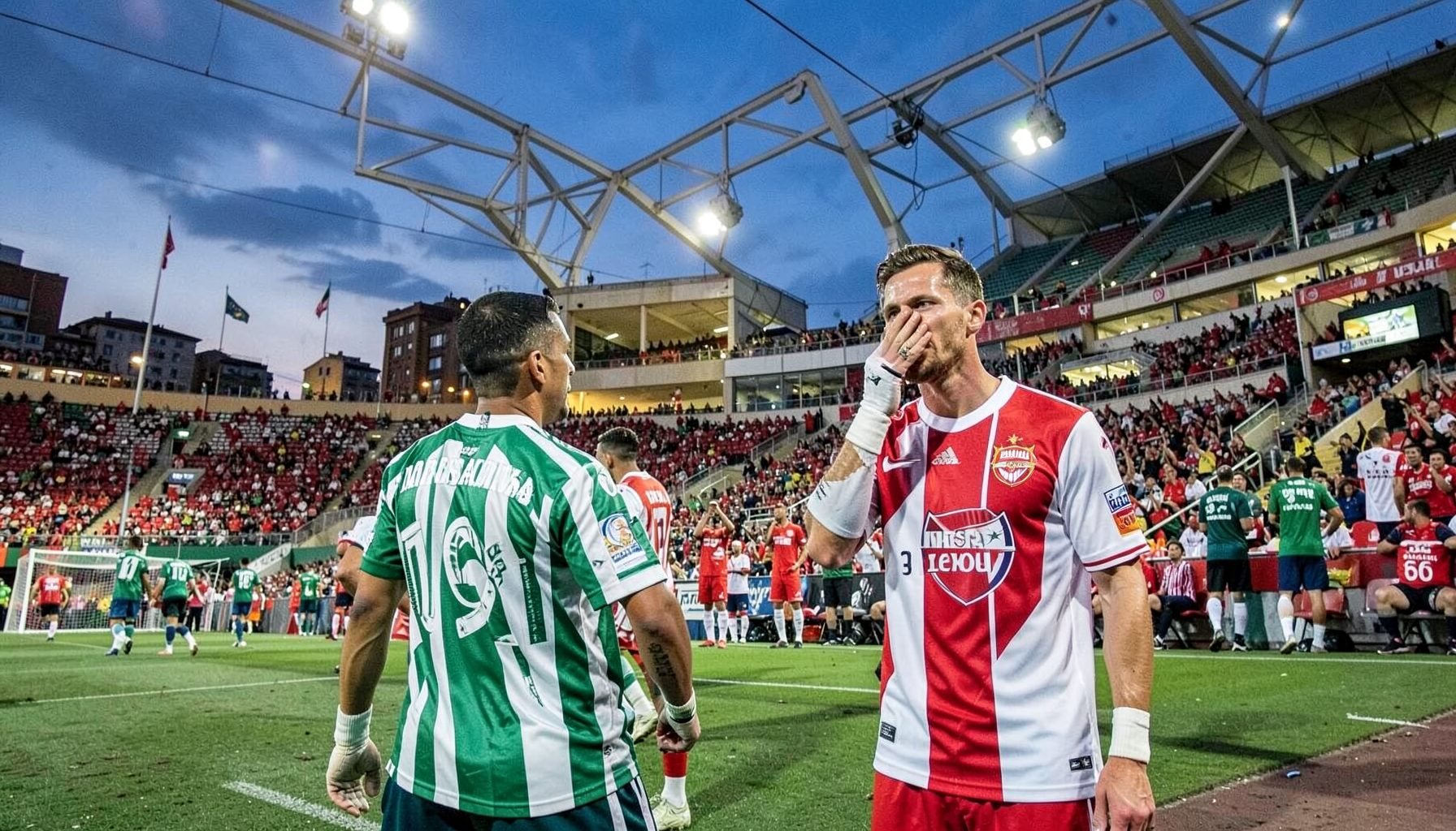 Sporting CP green-and-white hoops and Arsenal red-and-white at Estádio José Alvalade, vibrant Lisbon evening scene