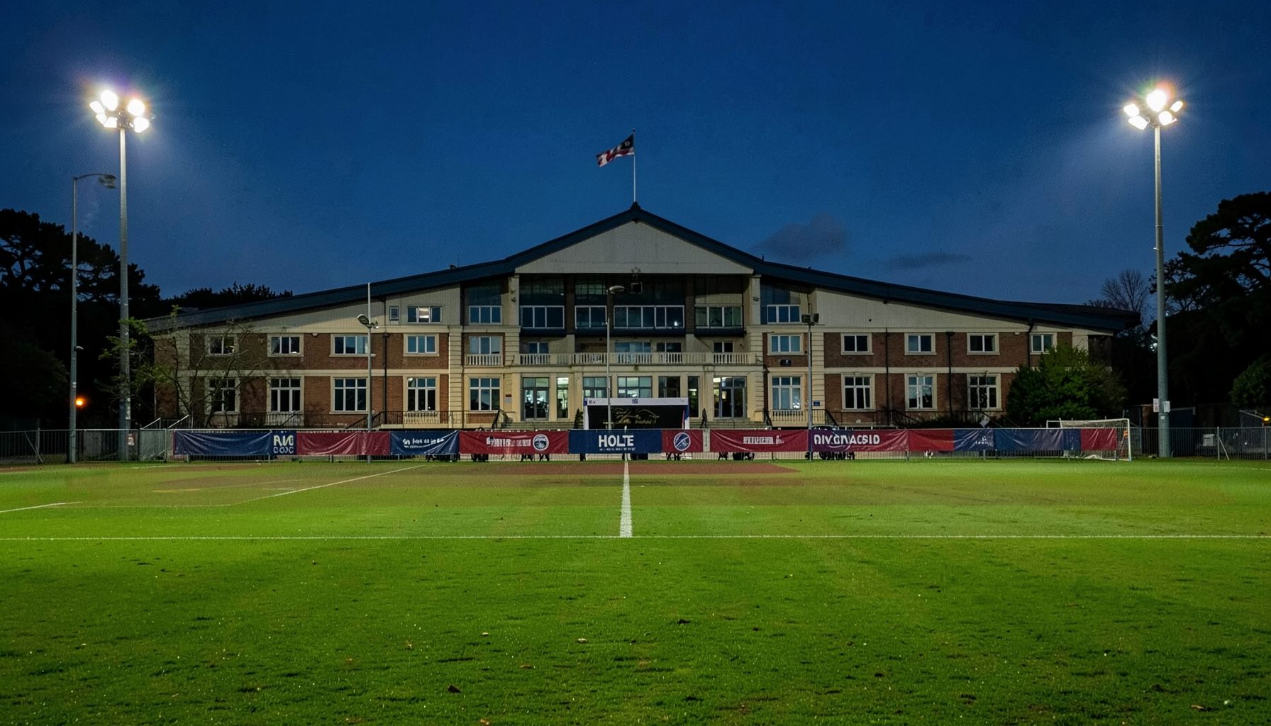 Villa Park under evening floodlights, claret-and-blue banners draped across the Holte End, the pitch freshly marked and glowing emerald green